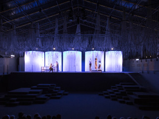 Spaghetti string curtains as cilinders on stage