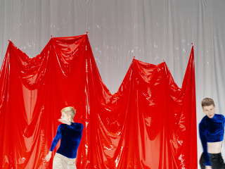 ShowTex red and white LaqueFoil backdrop for L'exposé by Philip Berlin
