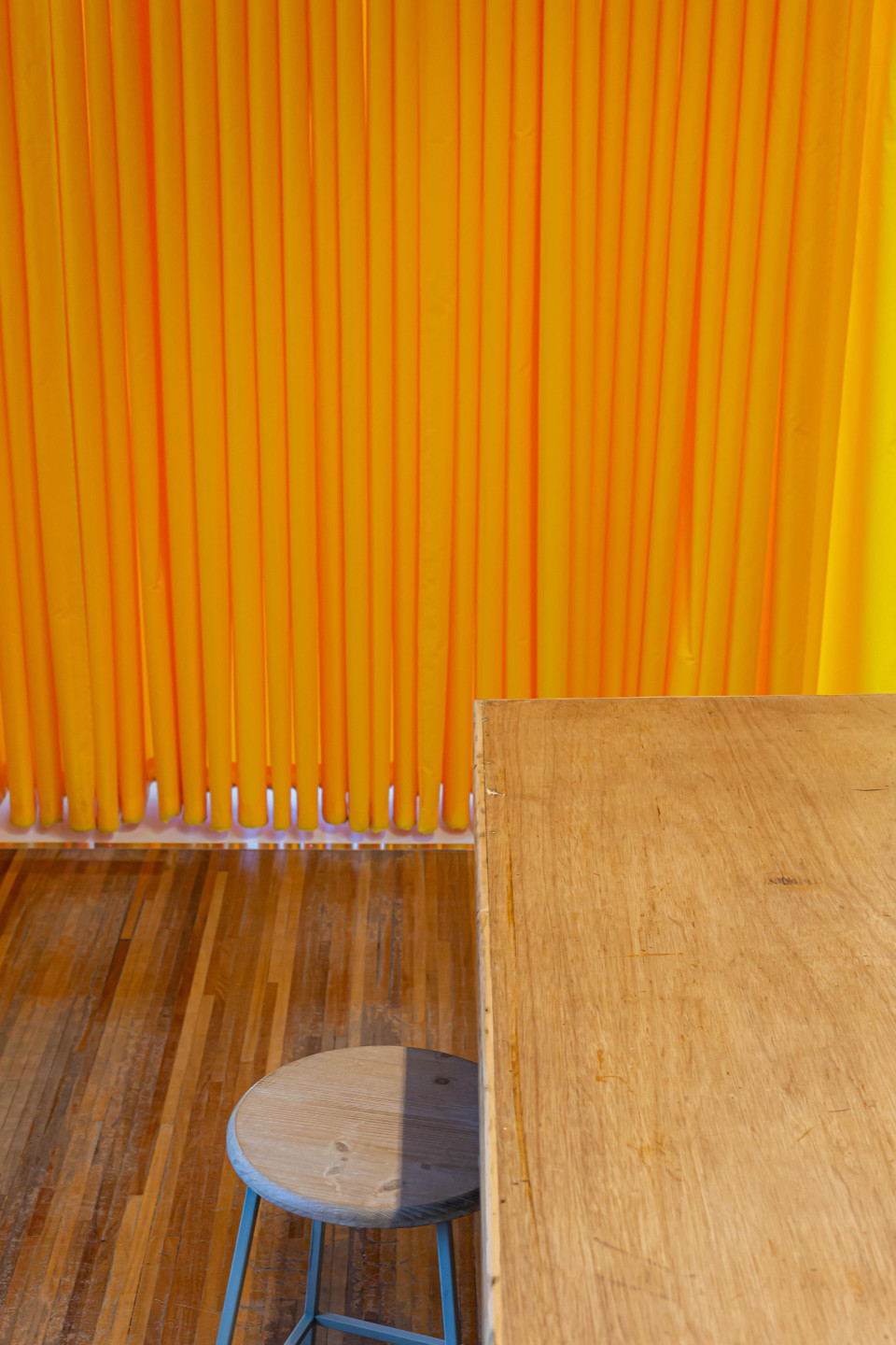Yellow partition curtains in creative maker space