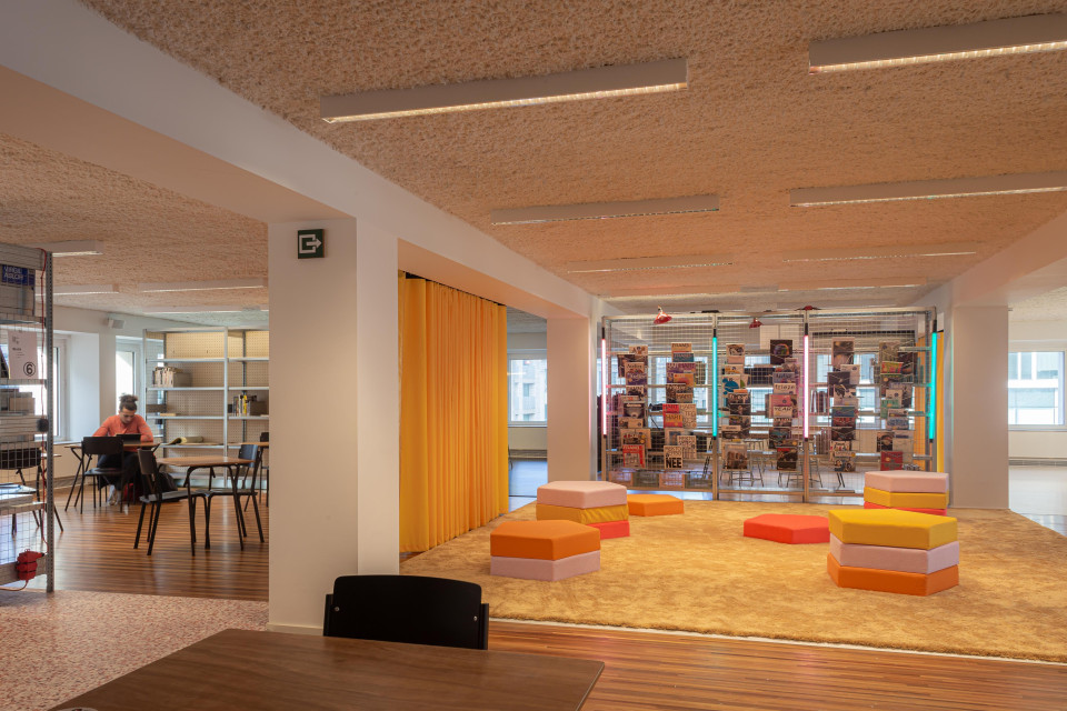 Bright yellow separation drapes generate multi-purpose room
