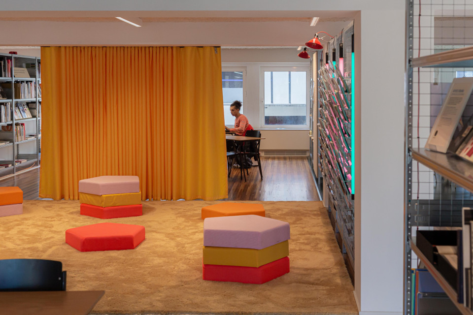 Bright yellow separation drapes generate multi-purpose room
